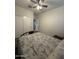 Bedroom features a ceiling fan, a double-door closet and neutral paint and carpet at 3012 N 310Th Ln, Buckeye, AZ 85396
