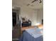Bedroom with carpet, a ceiling fan, and views into the bathroom at 3012 N 310Th Ln, Buckeye, AZ 85396