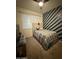 This bedroom offers a ceiling fan, window, and carpet flooring at 3012 N 310Th Ln, Buckeye, AZ 85396