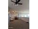 Bonus room featuring plush carpet, ceiling fan, natural light, and ample space at 3012 N 310Th Ln, Buckeye, AZ 85396