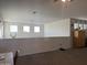 Bonus room featuring plush carpet, natural light, and ample space at 3012 N 310Th Ln, Buckeye, AZ 85396