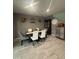 Comfortable dining room with a modern table set and unique wall decorations at 3012 N 310Th Ln, Buckeye, AZ 85396