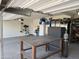 Spacious garage with a large metal workbench, storage cabinets, and ample room for projects at 3012 N 310Th Ln, Buckeye, AZ 85396
