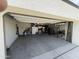 Open garage with storage cabinets, work bench, and clean concrete floor for multiple uses at 3012 N 310Th Ln, Buckeye, AZ 85396