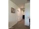 Hallway featuring plush carpet and natural light at 3012 N 310Th Ln, Buckeye, AZ 85396