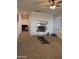 Hallway featuring plush carpet, natural light, and ample space at 3012 N 310Th Ln, Buckeye, AZ 85396