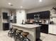 Well-appointed kitchen with a large island, ample storage, and stainless steel appliances at 3012 N 310Th Ln, Buckeye, AZ 85396