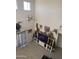 Spacious living room with high ceilings, a ceiling fan, and decorative taxidermy at 3012 N 310Th Ln, Buckeye, AZ 85396