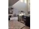 Open-concept living area featuring a granite countertop and modern furniture at 3012 N 310Th Ln, Buckeye, AZ 85396