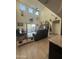 Bright living room with a vaulted ceiling and sliding glass door to backyard at 3012 N 310Th Ln, Buckeye, AZ 85396