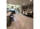 Open-concept living and dining area with tile floors and neutral colors at 3012 N 310Th Ln, Buckeye, AZ 85396