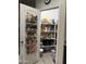 Walk-in pantry with organized shelving, offering ample storage and convenience at 3012 N 310Th Ln, Buckeye, AZ 85396