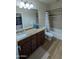 Bathroom features a single sink vanity, granite countertops, and a shower-tub combination at 3085 E Patrick St, Gilbert, AZ 85295