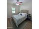 Comfortable bedroom features a queen bed, neutral colors, and natural lighting at 3085 E Patrick St, Gilbert, AZ 85295