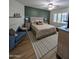 Stylish bedroom features a king-sized bed, wood floors, and a cozy seating area at 3085 E Patrick St, Gilbert, AZ 85295