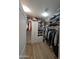 Walk-in closet features custom shelving, cabinets, and ample storage space at 3085 E Patrick St, Gilbert, AZ 85295