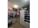 Walk-in closet features custom shelving, cabinets, and ample storage space at 3085 E Patrick St, Gilbert, AZ 85295