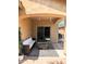 Covered patio with charming outdoor seating and a sliding glass door leading inside at 3085 E Patrick St, Gilbert, AZ 85295