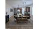 Open-concept dining room features sleek floors, stylish lighting, and is adjacent to the gourmet kitchen at 3085 E Patrick St, Gilbert, AZ 85295