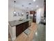 Open kitchen boasts granite countertops, stainless steel appliances, and ample cabinet space for storage at 3085 E Patrick St, Gilbert, AZ 85295