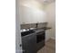 Spacious laundry room featuring white cabinetry above the washer and dryer units at 3085 E Patrick St, Gilbert, AZ 85295