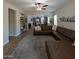 Spacious living room with sleek floors, a large sectional sofa, and abundant natural light is ideal for gatherings at 3085 E Patrick St, Gilbert, AZ 85295