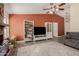 The home features a cozy living room with a beautiful fireplace, TV, and built-in shelving at 3124 W Taro Ln, Phoenix, AZ 85027
