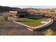 Aerial view of the amenity center and green space, perfect for relaxation and community engagement at 32237 N 133Rd Dr, Peoria, AZ 85383