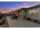 The backyard has desert landscaping, mountain views, and a covered patio at 32237 N 133Rd Dr, Peoria, AZ 85383