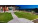 A landscaped green space with covered outdoor seating, perfect for relaxing and enjoying the outdoors at 32237 N 133Rd Dr, Peoria, AZ 85383