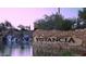Beautiful Vistancia community entrance featuring stone signage, lush desert landscaping, and a serene waterfall at 32237 N 133Rd Dr, Peoria, AZ 85383