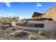 Beautiful Northpointe community entrance featuring modern desert landscaping and rock-covered grounds at 32237 N 133Rd Dr, Peoria, AZ 85383