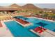 Beautiful community pool with blue shade covers and comfortable lounge chairs at 32237 N 133Rd Dr, Peoria, AZ 85383