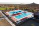 Enjoy the community's relaxing pool with many lounge chairs for residents at 32237 N 133Rd Dr, Peoria, AZ 85383