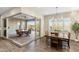 Elegant dining area with natural light and an open view of the outdoor patio at 32237 N 133Rd Dr, Peoria, AZ 85383