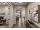 Inviting foyer with hardwood floors and an open view into the living room and outdoor patio at 32237 N 133Rd Dr, Peoria, AZ 85383