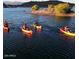 People enjoying kayaking on the lake, a serene setting with beautiful natural scenery at 32237 N 133Rd Dr, Peoria, AZ 85383