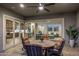 Cozy patio is open to the kitchen and living room with comfortable outdoor seating at 32237 N 133Rd Dr, Peoria, AZ 85383