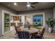 Cozy patio is open to the kitchen and living room with comfortable outdoor seating at 32237 N 133Rd Dr, Peoria, AZ 85383