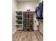 Well-organized walk-in closet with shelves and shoe rack, perfect for maximizing storage space at 32237 N 133Rd Dr, Peoria, AZ 85383