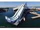 Large water slide on the lake, promising summer fun and aquatic adventure at 32237 N 133Rd Dr, Peoria, AZ 85383