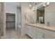 Elegant bathroom with double vanities, granite countertops, and a separate shower and tub at 3229 E Campbell Ave, Phoenix, AZ 85018