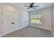 Bright bedroom with double closets and a sunlit window, providing ample storage and natural light at 3229 E Campbell Ave, Phoenix, AZ 85018