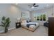 Serene bedroom with a cozy bed, plantation shutters, and a peaceful atmosphere at 3229 E Campbell Ave, Phoenix, AZ 85018