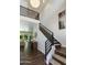 Bright foyer with wood flooring, a modern staircase, and soaring ceilings creates an open and airy entrance at 3229 E Campbell Ave, Phoenix, AZ 85018