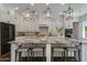 Gourmet kitchen with a granite island, pendant lighting, and stainless steel appliances at 3229 E Campbell Ave, Phoenix, AZ 85018