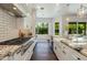 Well-appointed kitchen with an island, sleek appliances, and natural light streaming in at 3229 E Campbell Ave, Phoenix, AZ 85018