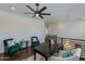 Open loft area with contemporary furnishings, including plush chairs, a modern chandelier, and sleek railing at 3229 E Campbell Ave, Phoenix, AZ 85018