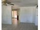 Open living area with tile flooring, flowing to the kitchen at 3419 W Glenn Dr, Phoenix, AZ 85051