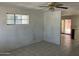 Living room features tiled floors, white walls and natural lighting at 3419 W Glenn Dr, Phoenix, AZ 85051